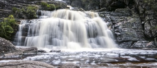 Close-up of a waterfall with water motion blur and pond, Caraca natural park, Minas Gerais, Brazil,