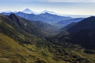 Beautiful autumn mountain landscape: scenery view of mountains, lake and volcanoes. Eurasia,