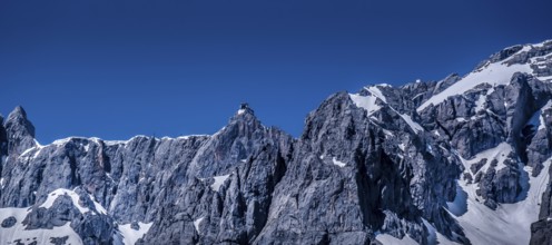 Bermassiv in Austria, Ramsau am Dachstein, rock face with mountain station on the summit #07.06.19