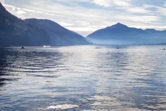 Amazing view of Lake Lugano with mountains on the other side of Lake Lugano and kayaks with