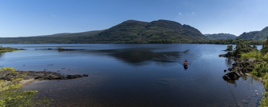 Muckross, Ireland, 10 August, 2022: tourists enjoy a boat ride on Muckross Lake in Killarney