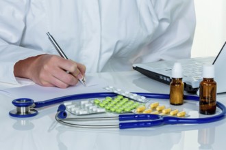 A young doctor prescribes medication. Prescription tablets are prescribed by the doctor. Austria
