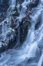 Landscape with frozen creek in wintertime. Icy Creek in wintertime in a beautiful landscape