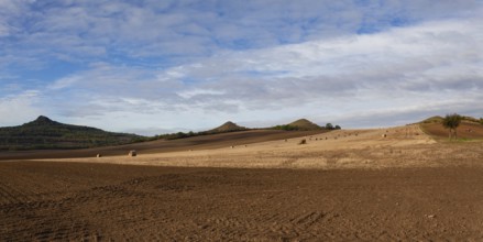Straw bales on a stubble in Central Bohemian Uplands, Czech Republic. Field landscape bales of