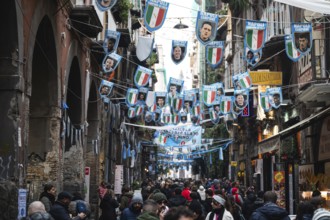 NAPLES, ITALY - JANUARY 14, 2024: A street with the pennants of the football team FC Napoli, the