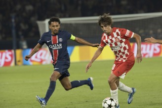 Football match, Bryan GIL Girona FC right on the ball fighting with MARQUINHOS Paris St. Germain,
