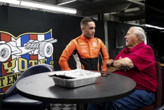 BENJAMIN PEDERSEN (R) (55) of Copenhagen, Denmark talks with A.J. Foyt prior to the Sunday morning