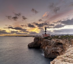 A view of the Portocolom Lighthouse in eastern Mallorca at sunset