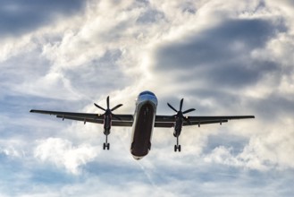 Aircraft on final approach to the airport shortly in front of landing