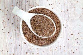 Top view of psyllium seeds in a white porcelain bowl
