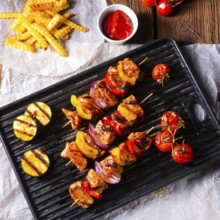 Rustic shish kebab skewers with marinated ham meat paprika and red onion