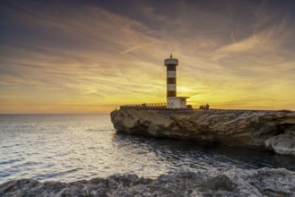 A view of the lighthouse at Colonia Sant Jordi in Mallorca at sunset