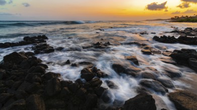 A dramatic sunset looking over the Pacific Ocean. Kauai, Hawaii