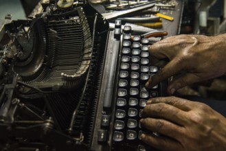 Technician repairing an old manual typewriter Mumbai, Maharashtra, India, Asia