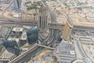 DUBAI, UAE - JANUARY 02, 2015: Dubai downtown sunrise morning scene. Top view from above