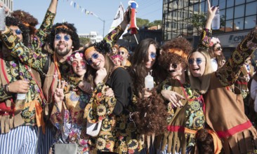 Limassol, Cyprus, February 18 2018: Happy team of people dressed in colourful costumes enjoying and