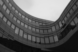 Wave-shaped building in the historic city centre, black and white, Düsseldorf, Germany, Europe