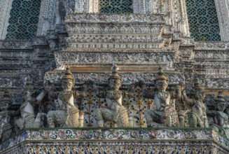 A picture of the statues at the Wat Arun Temple