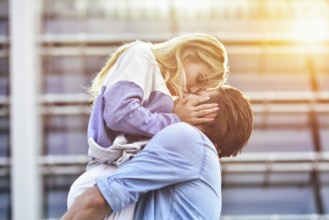 Happy to spending time together. Young beautiful couple outdoor fashion portrait