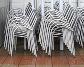 Packed stack of metal chairs