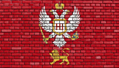 Flag of Principality of Montenegro painted on brick wall