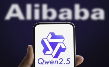 Alibaba Qwen 2.5 logo is displayed on smartphone