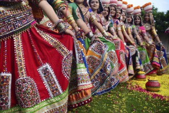 Girls in traditional attire, practice the Garba dance steps in preparation for the Navratri