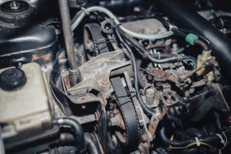 Close-up of a car engine with intricate mechanics and wiring