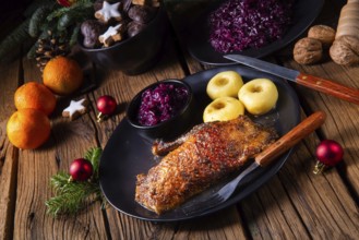 Roast goose with baked apples, red cabbage and dumplings