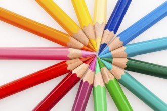 Many different coloured pencils on a white background, Many different colored pencils on white