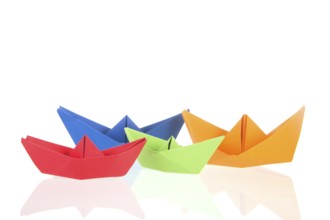 Folded boats and stack paper isolated over white background