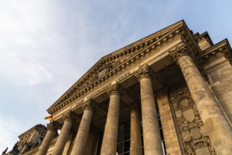 Berlin, Germany, July 28, 2019: Close-up low angle view of famous Reichstag building, seat of the