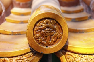 Close-up of resplendent glazed ornamental roof tiles on an imperial palace in Beijing, China in