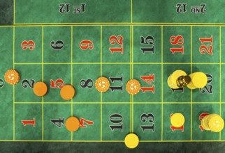 Roulette table chips in a casino. Closed up of casino roulette gambling table game. Yellow and