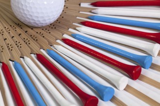 Typical Japanese hand fan made of bamboo and golf equipments