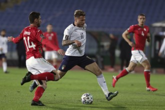 Sofia, Bulgaria - 27 March, 2021: Bulgaria's Daniel Dimov (L) in action with Italy's Ciro Immobile