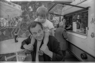 Germany, Berlin, 21 July 1991, poet Peter Wawerzinek (Schappy) with his daughter, (to the feeding