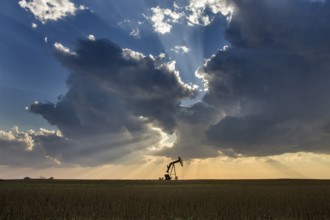 Prairie Storm Clouds Saskatchewan oil pump jack