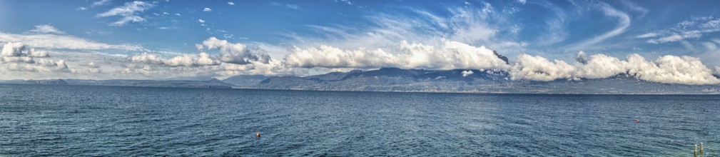 Garda Lake coast on a sunny day with beautiful clouds