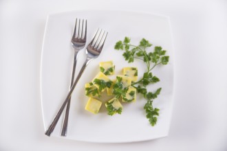 Frozen cubes of extra virgin olive oil flavored with parsley