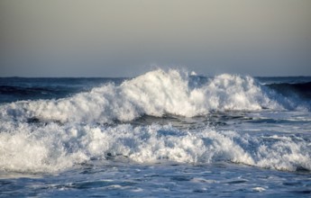 Dangerous wavy ocean with wind waves crashing during tropical storm