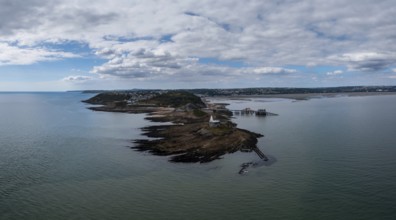 Aerial view of the Mumbles headland with the historic lighthouse and piers in Swansea Bay