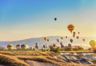 Morning sun and hot air balloons in Cappadocia
