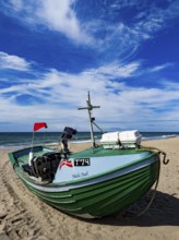 Fishing boat on Stenbjerg beach near Vorupor in Jutland, Denmark, Europe