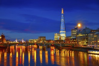 London skyline sunset on Thames river reflection at UK