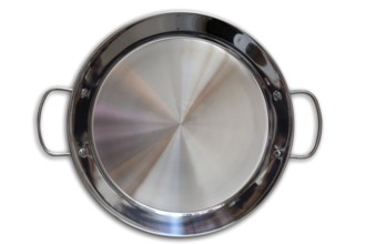 Paella pan in stainless steel on white background