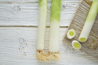 Leeks vegetable raw food with cutted texture in a white wood board table
