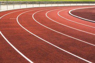 Cinder track in detail in a stadium in summer