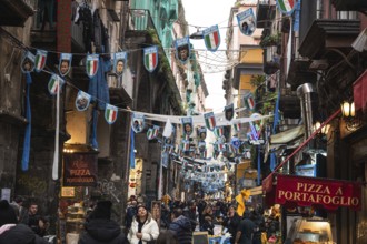 NAPLES, ITALY - JANUARY 14, 2024: A street with the pennants of the football team FC Napoli, the