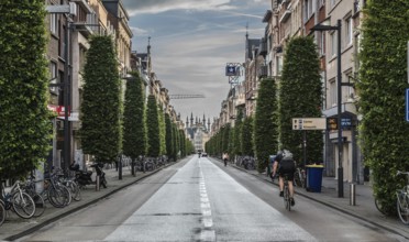 Leuven, Flanders, Belgium, 06 16 2019 Man on a bike driving down the Bondgenotenlaan at the